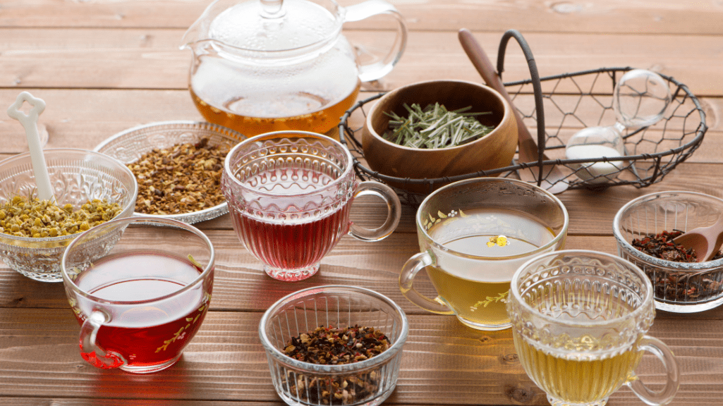 Different kinds of herbal teas on a rustic table