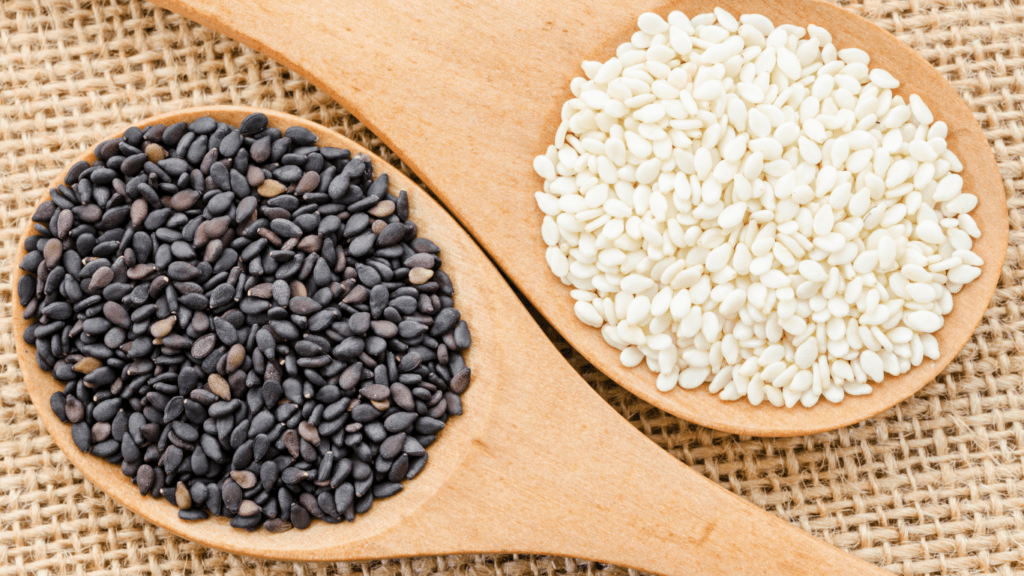 Sesame seeds on a wooden spoon